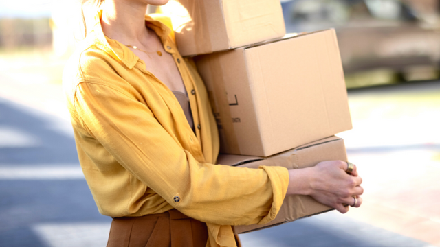Woman carrying boxes