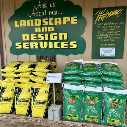 Landscaping SuppliesDisplay of IceAway and Dragon Melt bags with promotional signs for landscape and design services.
